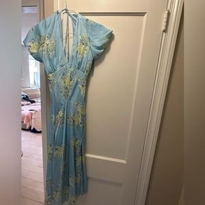 Free people floral satin dress. Size medium. Cross back. Worn once!